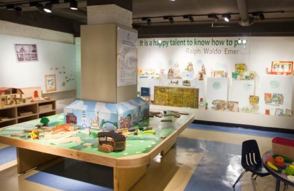 play train table and children's exhibits in the permanent children's activity space