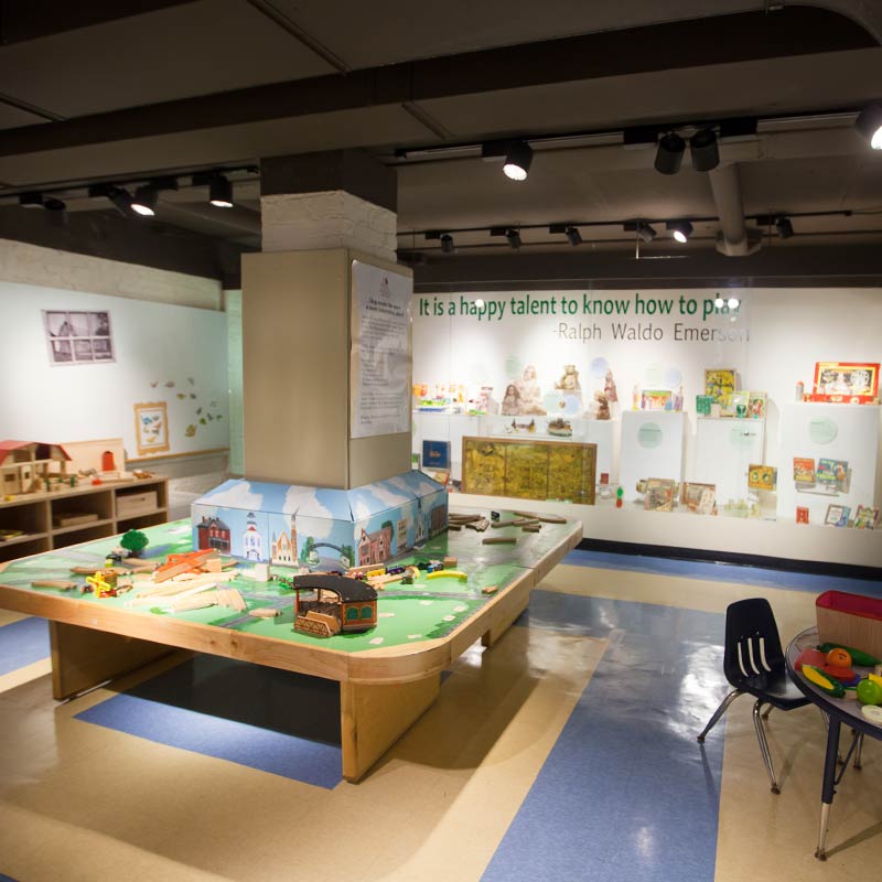 play train table and children's exhibits in the permanent children's activity space