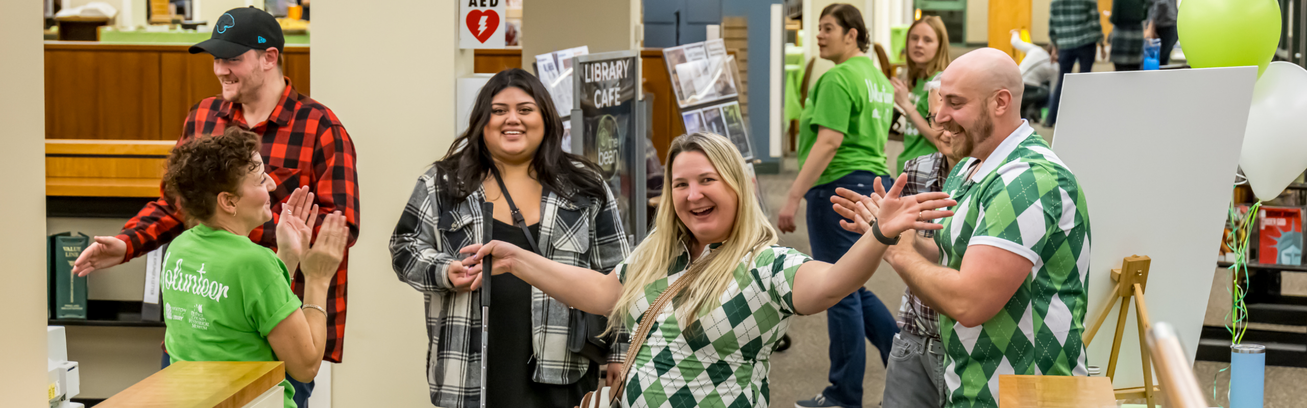 People in green golf attire at Mad Fore Plaid. Photo © 2025 Kmiecik Imagery