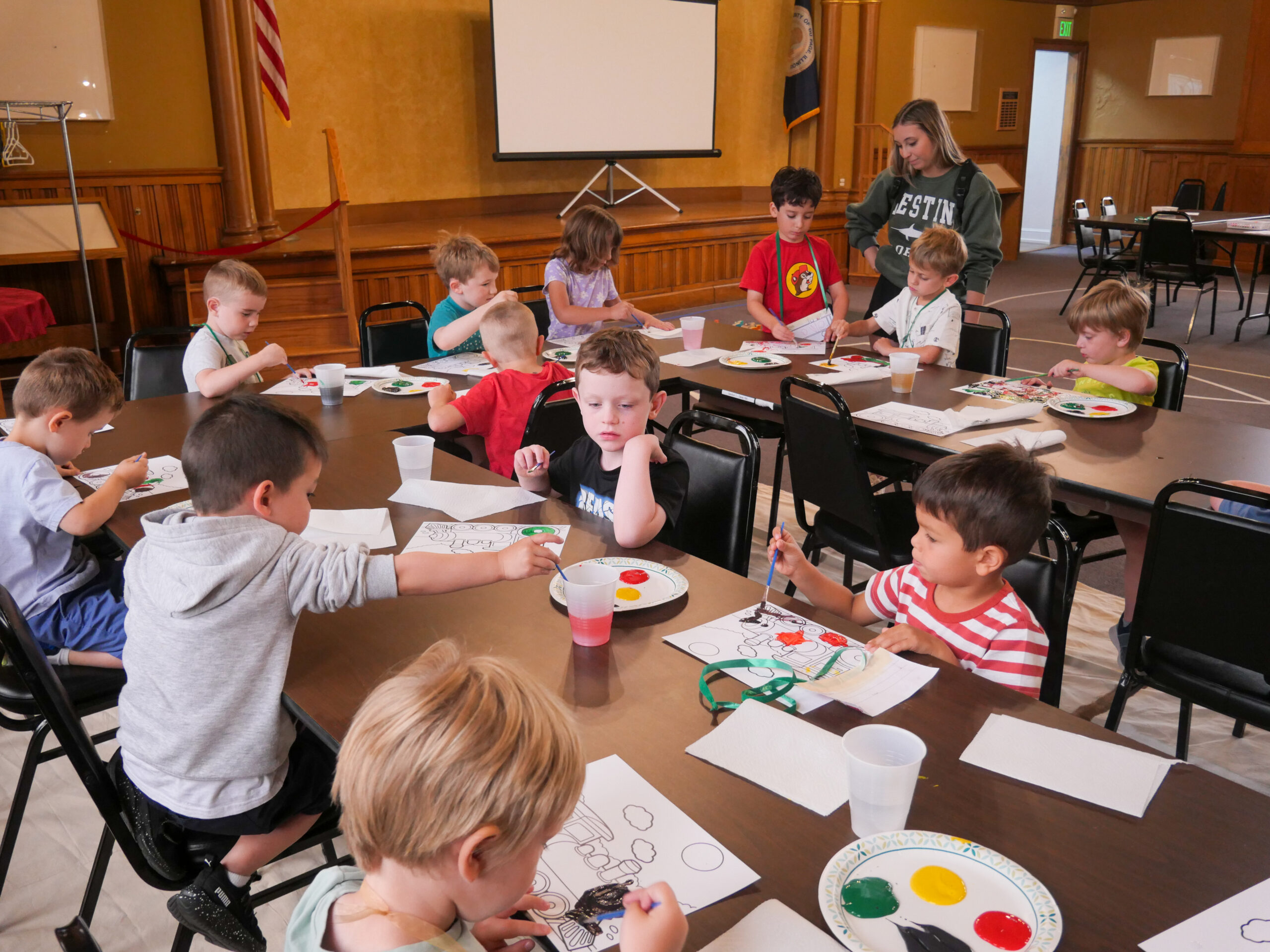 DCHM Birthday Train Theme A group of children painting model trains